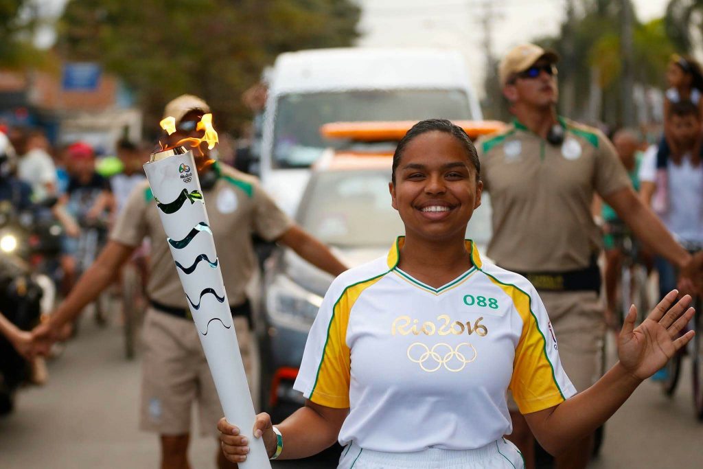UCONN Alumna carrying Olympic Torch