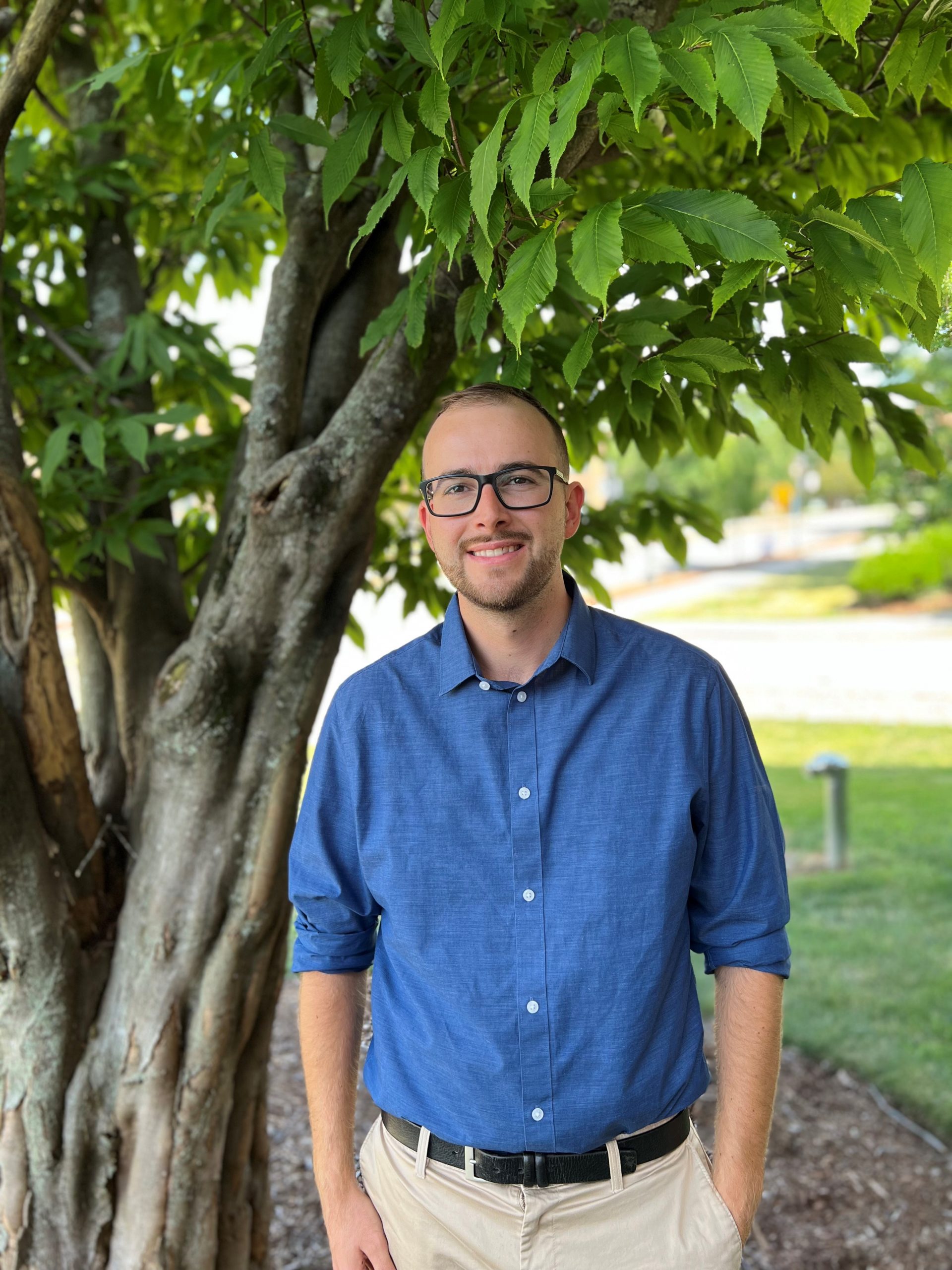 image of Fernando Rodriguez-Barberet standing in front of the CISS against a tree.